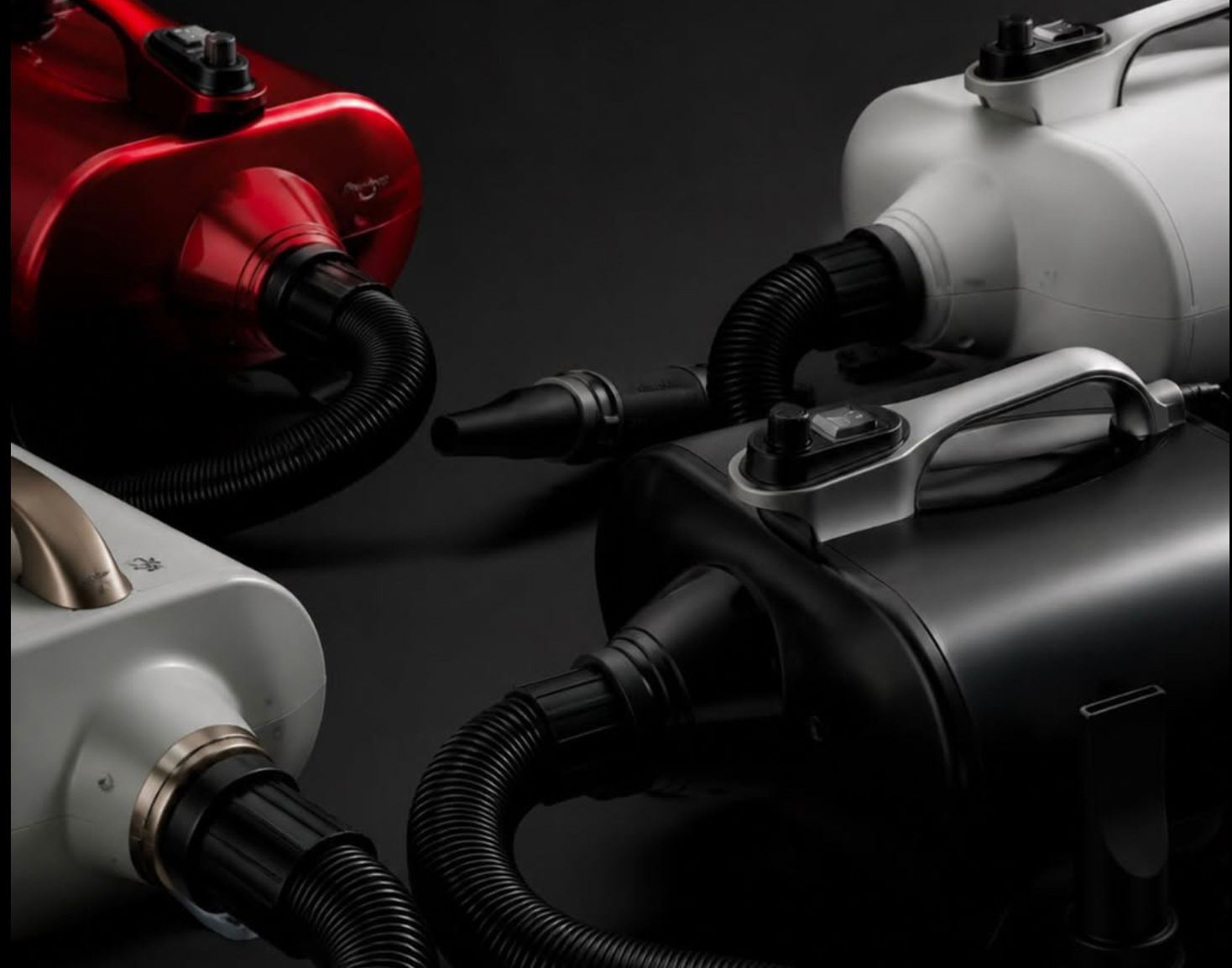 Professional high-velocity pet dryer blowing moisture out of a thick double coat